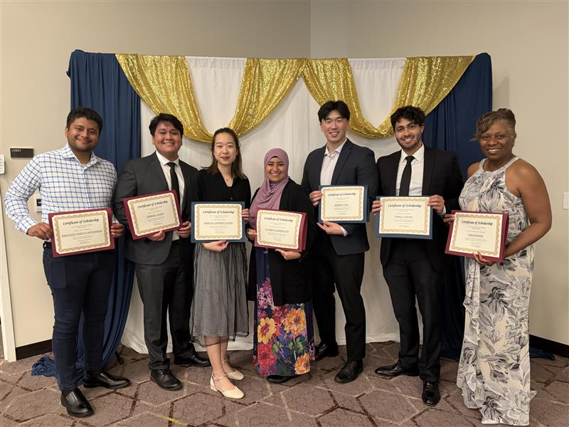 SR students pose with their scholarship certificates
