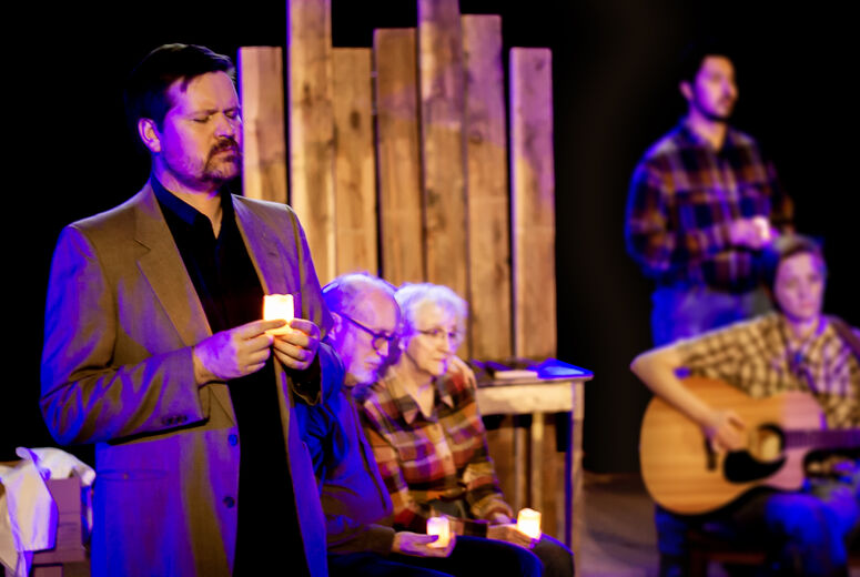 Actors perform in The Laramie Project