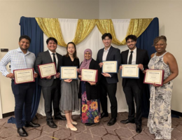 SR students pose with their scholarship certificates